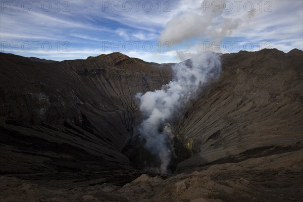 Bromo volcano inside crater with smoke and sulphur