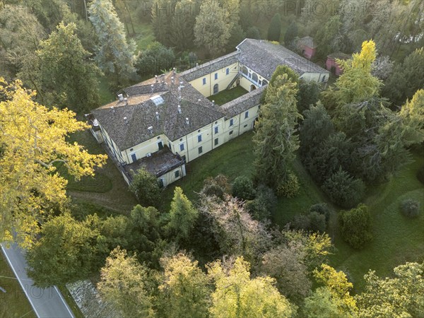 Aerial view of the sant'agata villa, the house of giuseppe verdi, surrounded by colorful autumn foliage in busseto, parma, italy. Busseto, Parma, Italy November 3rd 2024