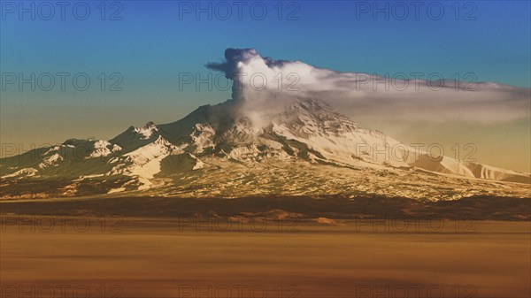 Winter volcanic landscape at sunrise, eruption crater active volcano on Kamchatka Peninsula. Effect of old film, vintage instant color photo effect, colorful picture with toned filter noise and grain