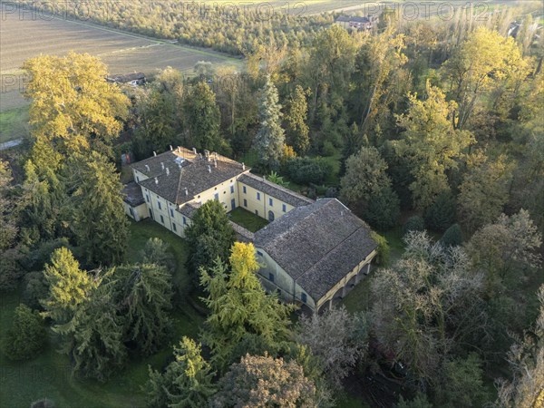 Aerial view of the sant'agata villa, the house of giuseppe verdi, surrounded by colorful autumn foliage in busseto, parma, italy. Busseto, Parma, Italy November 3rd 2024