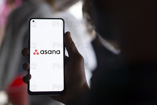 Dhaka, Bangladesh- 09 Nov 2024: Asana logo is displayed on smartphone