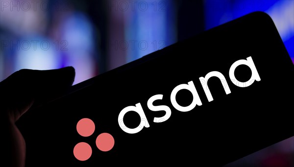 Dhaka, Bangladesh- 09 Nov 2024: Asana logo is displayed on smartphone