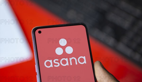 Dhaka, Bangladesh- 09 Nov 2024: Asana logo is displayed on smartphone