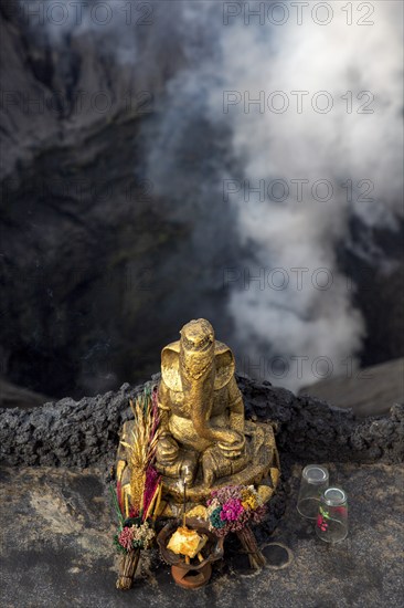 Hindu sacrificial altar with Ganesha the elephant made of gold on a volcanic crater