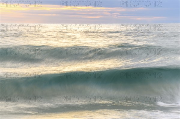 Wave crashing on a sandy beach of the Atlantic Ocean. Sables d'Olonne, Vendee, Pays-de-la-Loire, France, Europe