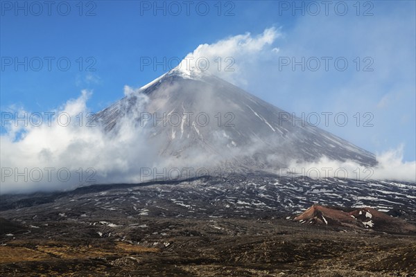 Autumn mountain landscape view of eruption active Klyuchevskoy Volcano (Klyuchevskaya Sopka), highest mountain on Kamchatka Peninsula (Russian Far East), highest active volcano of Europe and Asia