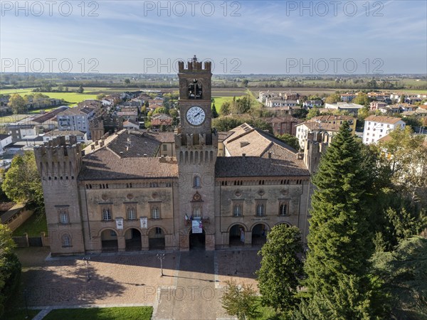 Busseto, Parma, Italy November 3rd 2024 Aerial view of palazzo orlandi torre, town hall, showcasing its clock tower and surrounding park