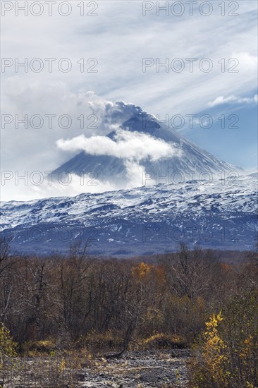 Volcanic landscape of Kamchatka: active Klyuchevskaya Sopka, view of volcanic eruption, plume of gas, steam and ash from crater. Kamchatka Peninsula, Russian Far East, Klyuchevskaya Group of Volcanoes