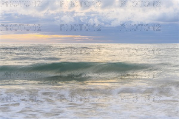 Wave crashing on a sandy beach of the Atlantic Ocean. Sables d'Olonne, Vendee, Pays-de-la-Loire, France, Europe