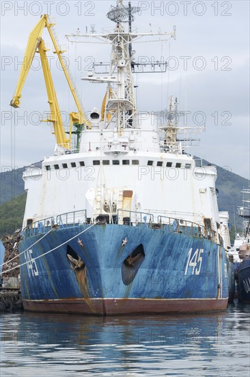 Russian warship Coast Guard of Border Guard Service of Russian FSB anchored at pier in seaport of Petropavlovsk-Kamchatsky City. Pacific Ocean, Kamchatka Peninsula, Russian Far East, 5 Sep, 2018