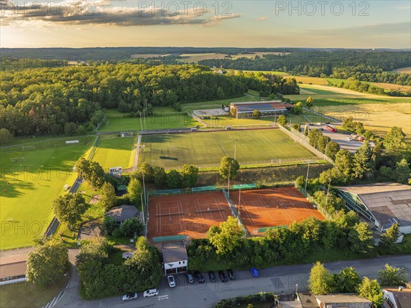 Aerial view of a sports facility with tennis courts and football pitches, surrounded by woods and fields, Gechingen, Black Forest, Germany, Europe