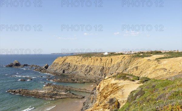 Rocky coastal landscape Praia dos Alteirinhos beach in bay with rocky headland part of Parque Natural do Sudoeste Alentejano e Costa Vicentina, Costa Vicentina and south west Alentejo natural park, Zambujeira do Mar, Alentejo Littoral, Portugal, southern Europe, Europe