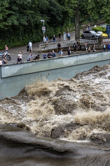 Weir of the Lake Baldeney in Essen, the masses of water roar through the open weirs, spectators, onlookers, high water on the Ruhr, after long heavy rains the river came out of its bed and flooded the landscape and villages, the highest water level ever measured, North Rhine-Westphalia, Germany, Europe