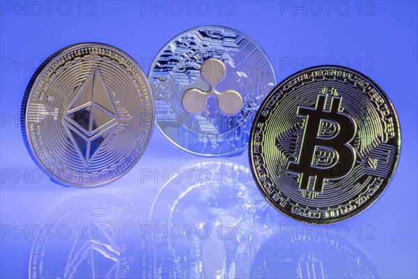 Various cryptocurrencies, symbol coins, optical placeholder for the digital currency, blockchain, Bitcoin, Ripple, Ethereum, from right to left