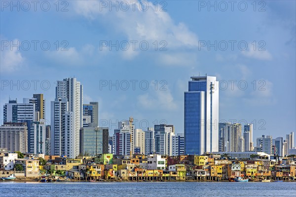 Skyscrapers in the city of Recife in Pernambuco behind the favela on the banks of the Capibaribe River, Recife, Pernambuco, Brazil, South America