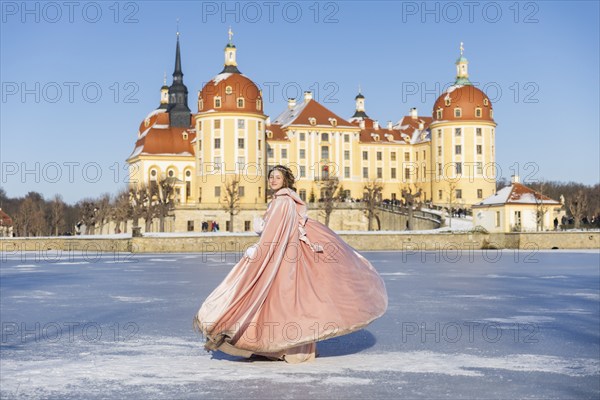 This year, the most popular fairytale film of all time is celebrating a special anniversary. At Moritzburg Castle, one of the film's locations, the exhibition of the cult film Three Hazelnuts for Cinderella opens for the twelfth time - with an anniversary-worthy supporting programme and special exhibition. Model Tamara Kretschmer once again slips into the coveted role of the legendary Cinderella with the ball gown, Moritzburg, Saxony, Germany, Europe