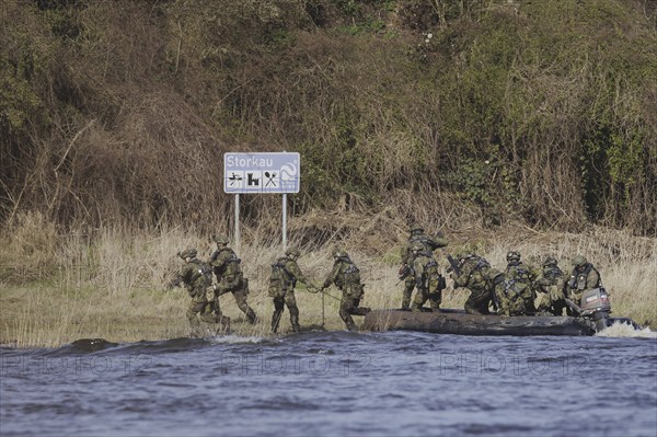 Soldiers on an inflatable boat, taken as part of the military exercise 'Wettiner Schwert' with German and Czech soldiers near Tangermünde, 26 March 2024. 'Wettiner Schwert' is part of the NATO Quadriga exercise