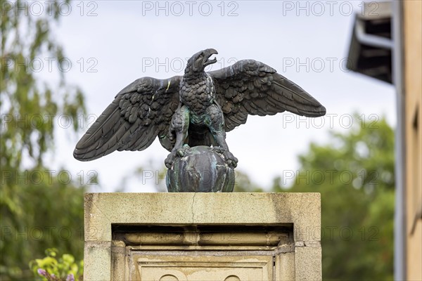 Eagle with globe, sculpture, artwork at a courtyard entrance in Stuttgart, Baden-Württemberg, Germany, Europe