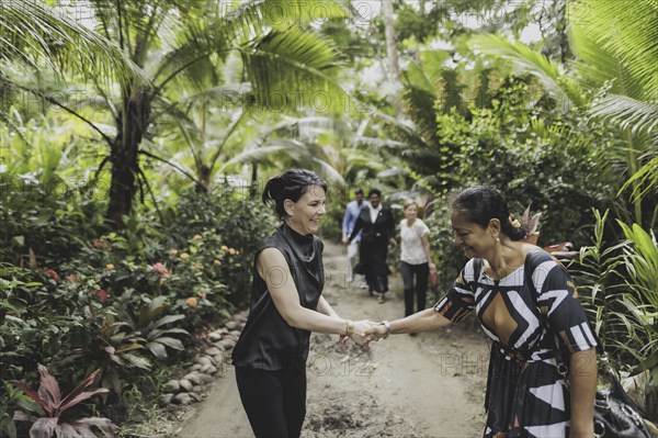 (L-R) Annalena Bärbock (Bündnis 90/Die Grünen), Federal Foreign Minister, and Christine Fung, employee of the Deutsche Gesellschaft für Internationale Zusammenarbeit, photographed during a briefing on coastal erosion at a cemetery near the settlement of Togoru, flooded by rising sea levels, 07.05.2024. Bärbock is travelling to Australia, New Zealand and Fiji for political talks / Photographed on behalf of the Federal Foreign Office