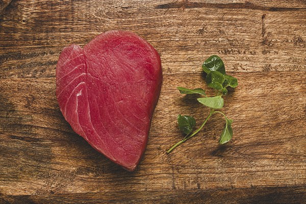 Fresh red tuna fillet, for steak, raw, top view, on a cutting board, no people