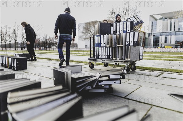 Files are cleared away after a protest action by the German Confederation of Skilled Crafts in front of the Federal Chancellery in Berlin, 26 February 2024. The German Confederation of Skilled Crafts demonstrates against the economic policy of the federal government as well as the high level of bureaucracy and the improvement of location conditions