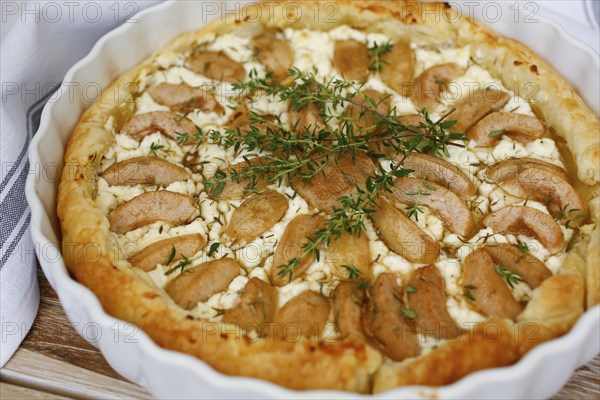 Tart with Gaishirtle and sheep's cheese, Stuttgarter Gaishirtle, pear variety, fruit, thyme, baking, typical Swabian, Swabian cuisine, traditional cuisine reinterpreted, vegetarian, food photography, studio, Germany, Europe