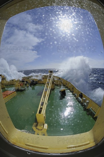 Bullseye with sunb look to bow of Icebreaker Kapitan Khlebnikov in rough seas at the way to Ushuaia, Drake passage, Southern Atlantic Ocean, Anartica, South America