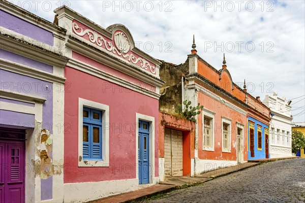 Old houses with their colorful facades on the streets and slopes of the historic city of Olinda, Olinda, Pernambuco, Brazil, South America