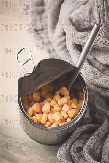 Open tin can, with corn, top view, selective focus, no people, close-up