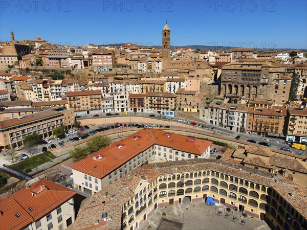 Aerial view of a historic city with many tiled roofs and a striking tower in the centre, aerial view, church, Iglesia de Santa María Magdalena, bishop's palace, Palacio Episcopal, Plaza de Toros, bullring, Tarazona, Zaragoza, Aragon, Spain, Europe