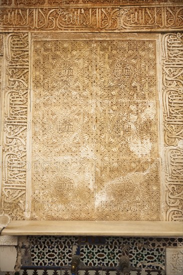 Finely carved stonework with Islamic inscriptions in the Alhambra, Granada, Spain, Europe