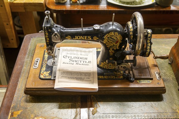 Jones Sewing Machine Company Family Cylinder Shuttle model with instruction manual on display in auction room, UK