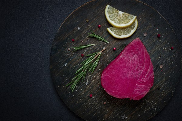 Fresh red tuna fillet, for steak, raw, top view, on a cutting board, no people