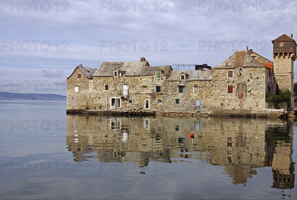 Old fortification from the Mediterranean reflected in the water, town of Kastela, Split, Dalmatia, Croatia, Europe