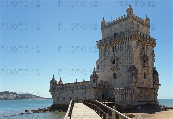 Medieval tower stands on a small promontory by the water, Torre de Belém, World Heritage Site, Belem, Bethlehem, Lisbon, Lisboa, Tagus River, Portugal, Europe