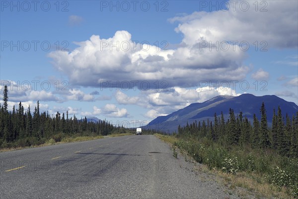 Endless road with single motorhome, adventure, forest, wilderness, Alaska Highway, Yukon Territory, Canada, North America