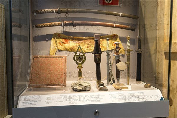 Display cabinet of Second World war trophies from Germany and Japan, REME museum, MOD Lyneham, Wiltshire, England, UK