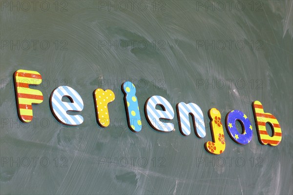 Symbolic image of holiday job: (school) board with the inscription FERIENJOB