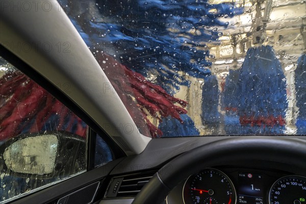 Car in an automatic car wash, car wash tunnel