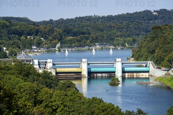 Lake Baldeney, a Ruhr reservoir, dam wall, with hydroelectric power plant power station, behind the regatta tower with grandstands, in Essen, North Rhine-Westphalia, Germany, Europe