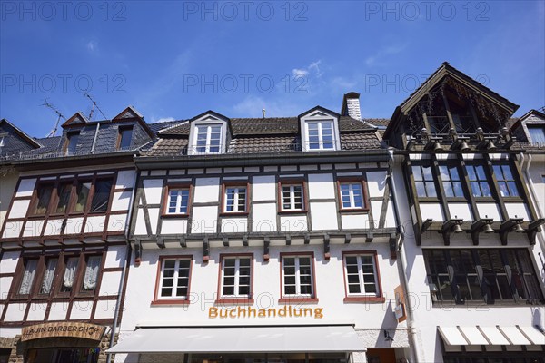 Library and barbershop on Marktstraße in Bad Münstereifel, Eifel, Euskirchen district, North Rhine-Westphalia, Germany, Europe