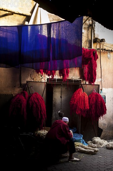 Wool for drying in the dyer's souk, dyer, colours, red, blue, complementary, contrast, colour contrast, presentation, oriental, dyeing, market, medina, bazaar, culture, craft, traditional, Marrakech, Morocco, Africa