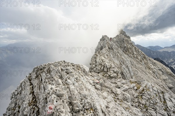 Clouds around a narrow rocky ridge, Watzmann crossing to Watzmann Mittelspitze, view of mountain panorama, Berchtesgaden National Park, Berchtesgaden Alps, Bavaria, Germany, Europe