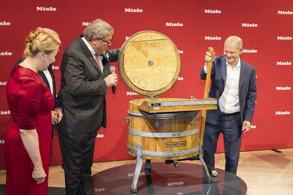 Olaf Scholz (Chancellor of the Federal Republic of Germany, SPD) operates the first Miele washing machine during a press tour of the IFA (Internationale Funkausstellung) exhibition at the trade fair grounds, Berlin, 06/09/2024