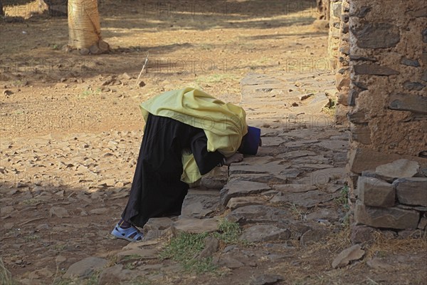 Amhara region, Gondar, Gonder, Moench prays in front of the Debre Berhan Selassie church, Ethiopia, Africa