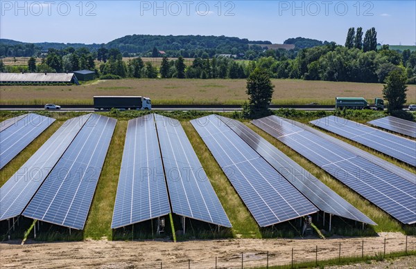 Solar park near Neukirchen-Vluyn, along the A40 motorway, over 10, 000 solar modules spread over 4.2 hectares, generating 6 million kilowatt hours per year, North Rhine-Westphalia, Germany, Europe