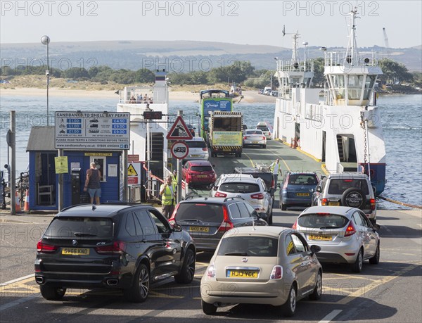 Vehicles boarding the Sandbanks to Shell Bay Studland ferry boat, Sandbanks, Dorset, England, UK