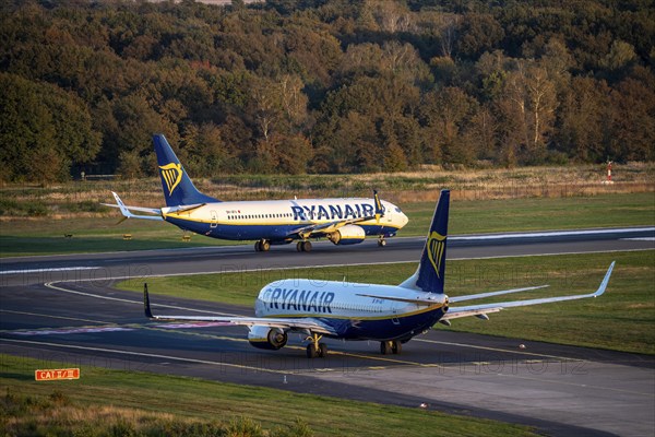 Ryanair Boeing 737 taxis to the runway, another Ryanair aircraft taxis for take-off, Cologne-Bonn Airport, CGN, North Rhine-Westphalia, Germany, Europe