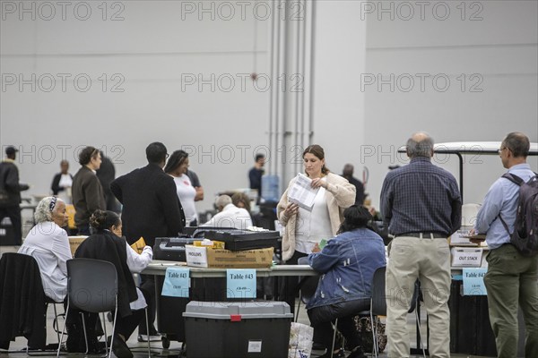 Detroit, Michigan USA, 5 November 2024, City of Detroit election workers count absentee ballots on election day at the city's convention center