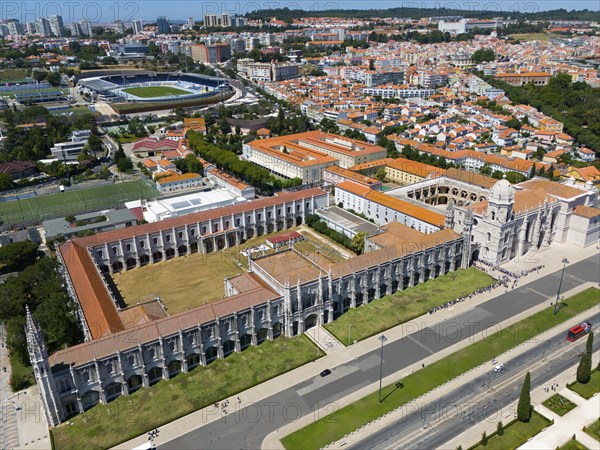 Aerial view of a large monastery in an urban landscape with green areas and urban structures in the background, aerial view, Jerome Monastery, Mosteiro dos Jerónimos, Jerome Monastery, World Heritage Site, Monastery Church of Santa Maria, Belém, Belem, Bethlehem, Lisbon, Lisboa, Portugal, Europe